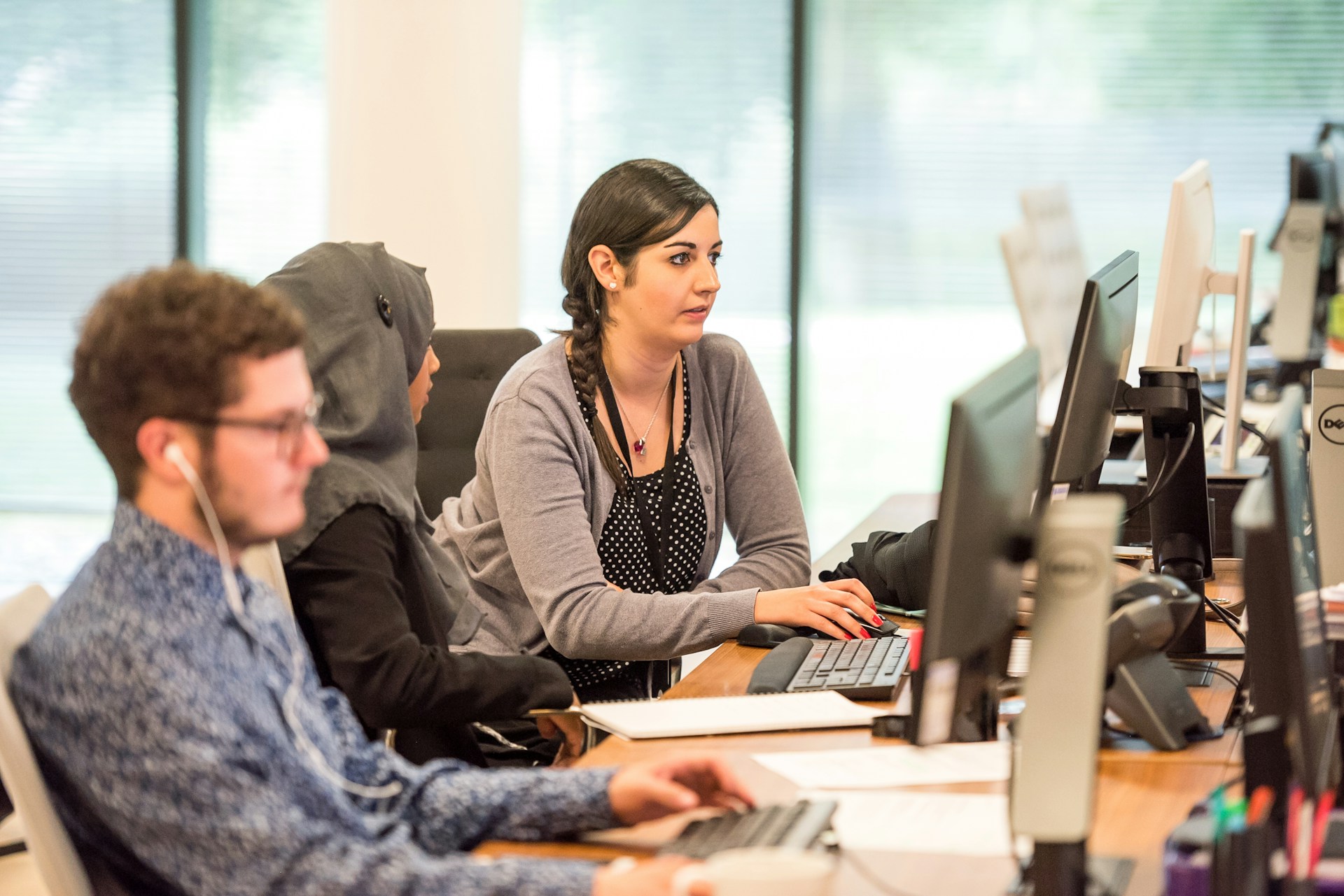 Customer Support Trends 2025 - a photo of a lady supporting a customer